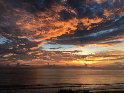 Cloudy and colorful sunrise over the Atlantic Ocean in Orchid