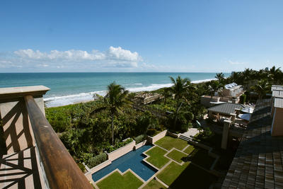 View from the upper balcony of the Orchid Island Beach Club overlooking a garden, the dunes and the Atlantic Ocean