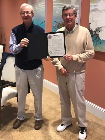 Mayor Gibbons presents former-Mayor Ofstie with a proclamation in his honor.