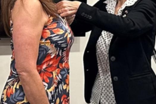Orchid Town Clerk Jane Garcia receives her Master Municipal Clerk pin from FACC President Patricia Burke
