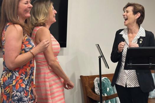Town Clerk Jane Garcia and Town Manager Cherry Stowe laugh with FACC President Patricia Burke